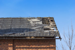 Damaged asbestos roofing material